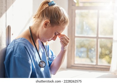 Headache, stress and burnout of woman doctor, sad worker and medical employee. Frustrated, depression and tired nurse in hospital, mental health challenge and anxiety, pain and emotion of bad news - Powered by Shutterstock