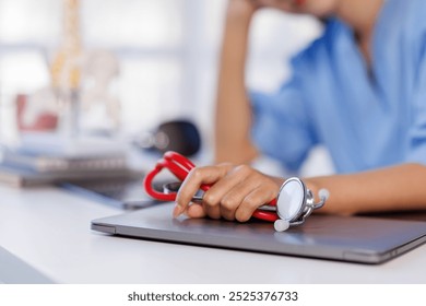 Headache stress, nurse or doctor asian woman in hospital feeling pain, tired or sick. Healthcare, wellness or female medical physician with depression or burnout while working late on laptop
 - Powered by Shutterstock