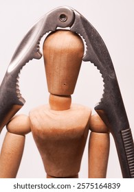 Headache symbolized with a doll and a nutcracker