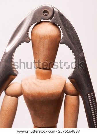 Headache symbolized with a doll and a nutcracker