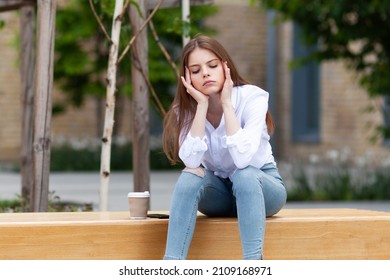 Headache In A Young Woman. Calm Down After Stress At Work.