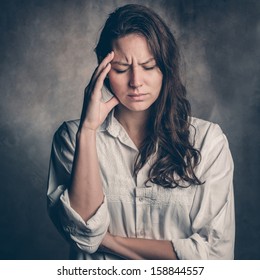 Headache - Young Woman Holding Head