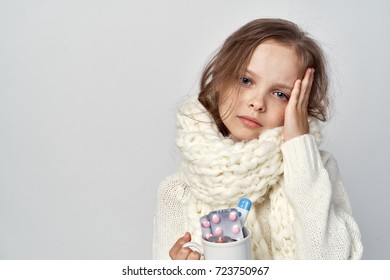 Headaches, Pills, Mug, The Child Is Sick With Flu On A Light Background, Poor Health                               