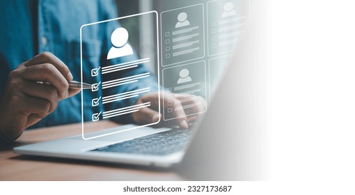 Headhunter using pen to tick correct mark to screening and select the optimum resume application form , Human development and recruitment to interview and join with company concept.