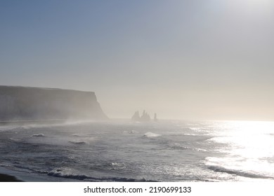 Headland Cliffs Being Covered With The Ocean Mist