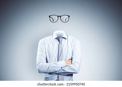 Headless invisible businessman with folded arms and abstract glasses standing on gray wall background. Business and secret concept