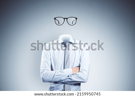 Headless invisible businessman with folded arms and abstract glasses standing on gray wall background. Business and secret concept