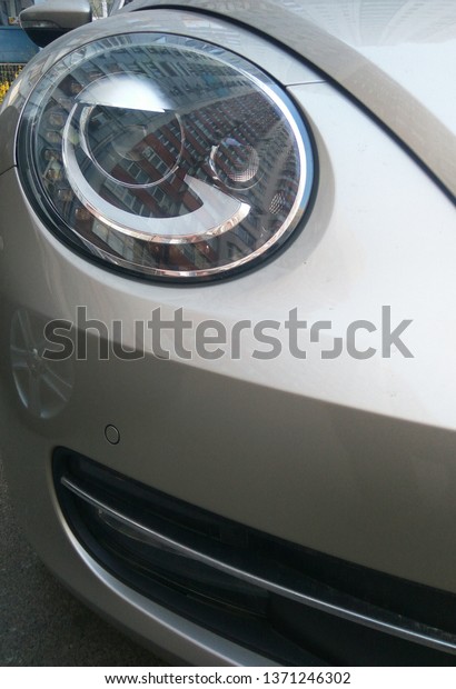 Headlight and bumper\
of car,  Kyiv, Ukraine\
