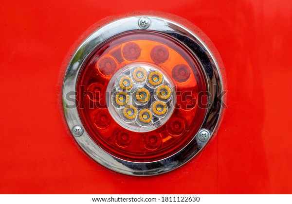 headlight from the car\
on a red background