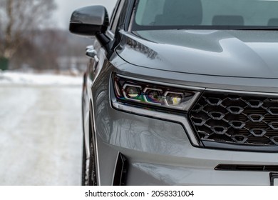 Headlight Lamp Of New Cars. Close Up Detail On One Of The LED Headlights Modern Black Car. Exterior Closeup Detail. Closeup Headlights Of Car.