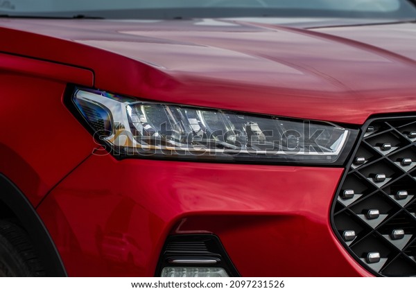 Headlight lamp of new cars. Close up detail on one\
of the LED headlights modern car. Exterior closeup detail. Closeup\
headlights of car.