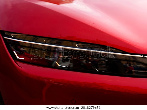 Headlight. LED headlamp of a modern car.\
Frontal lighting of highway vehicles with daytime running lights.\
Cars ambient lighting. Bi-Xenon headlamps and LED automotive\
lighting of a next\
generation.