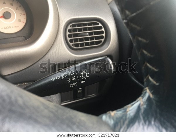 headlight\
and left right signal controlling stick in\
car.