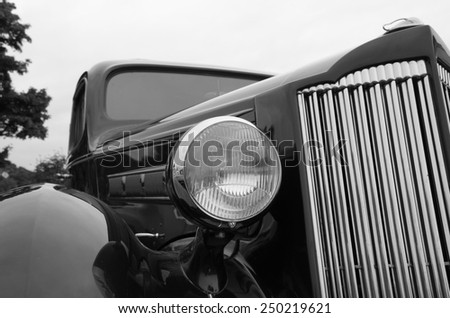 Headlight of old classic Packard Six Touring Sedan from 1937.
