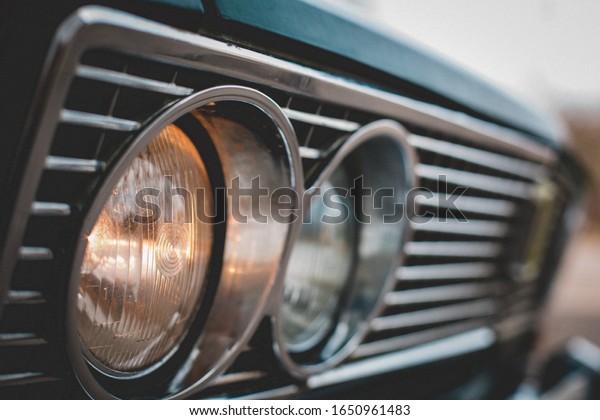Headlight of an old Soviet\
car close-up