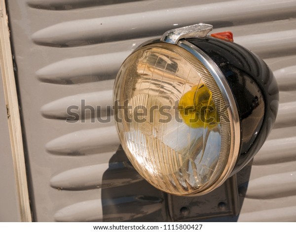 headlight of an old vintage pickup truck in\
Annecy, France