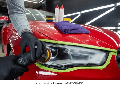 Headlight polishing. Adhesive tape on car headlights. Detailing car outside. - Powered by Shutterstock