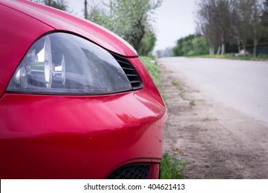 Headlight of red car - Shutterstock ID 404621413