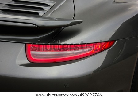 Headlights car. Car lights. Gray car. Luxury taillights