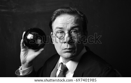 Headmaster with globe