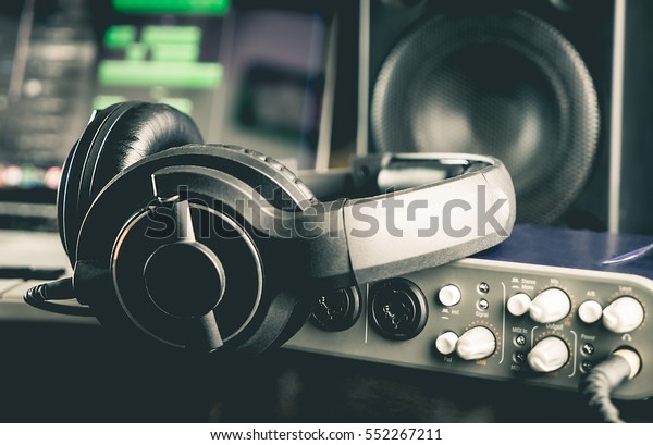 Headphone with other professional audio Sound\
studio portable equipments. For Home music producing set up concept\
on Laptop Computer.