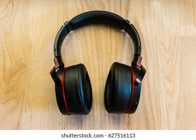 Headphone placed on wooden table