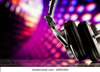 headphones against purple disco background