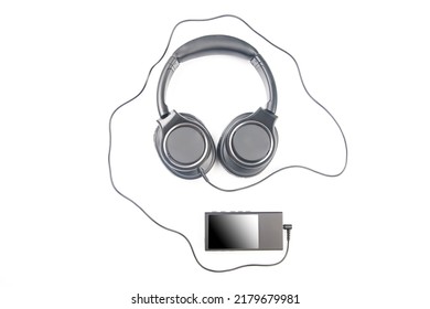 Headphones For Listening To Music With Digital Audio Player On White Background