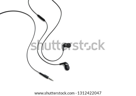 Headphones for listening music and sounds on portable devices on a white background. Ear plugs. Earflaps for a mobile phone. Headset from two earpieces. Playing music