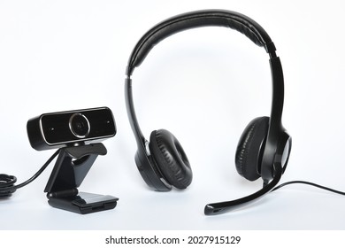 headphones with mic and a webcam, concept of smart working or online communications.