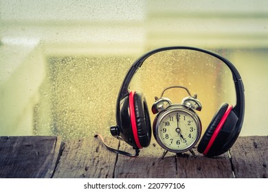 Headphones With Old Clock.music Time. Vintage Retro