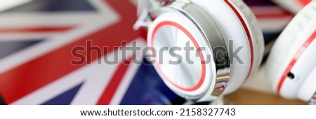 Headphones on the background of the flag of Great Britain