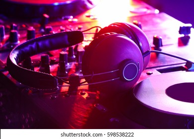 Headphones On Dj Mixer In Nightclub