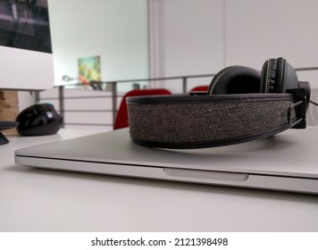 Headphones On A Laptop In An Office Setting