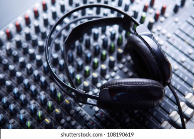 Headphones on soundmixer - Powered by Shutterstock