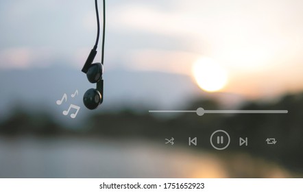 Headphones And Playlist Listen To Music At Sunset