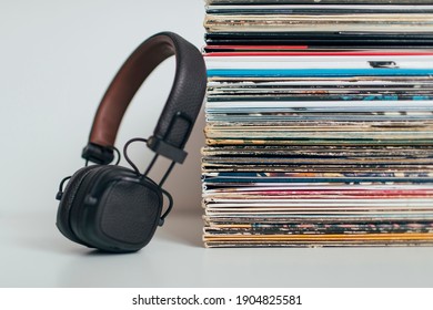 Headphones With Stack Of Vinyl Records Collection