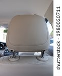 headrest in modern luxury comfortable car with the beige perforated leather