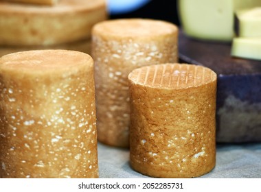 Heads of cheese of different grades and colors close-up. Selective focus. High quality photo