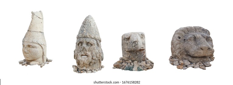 Heads on East terrace at the top of Nemrut dagi in Turkey. The UNESCO World Heritage Site at Mount Nemrut where King Antiochus is reputedly entombed. Isolated on white background.