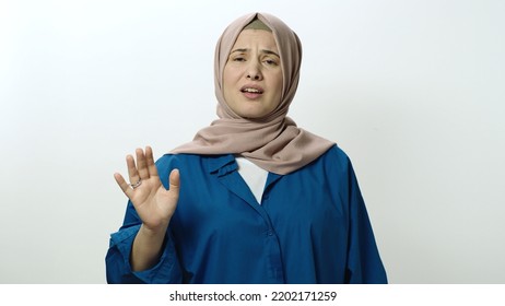 The Headscarved Woman Is Very Angry At What Happened. She Shouts Explaining That He Is Angry. Portrait Of Angry Woman. Indoor Studio Shot Isolated On White Background.