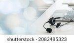 Headset and customer support equipment at call center ready for actively service . Corporate business help desk and telephone assistance concept .