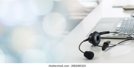 Headset and customer support equipment at call center ready for actively service . Corporate business help desk and telephone assistance concept .
