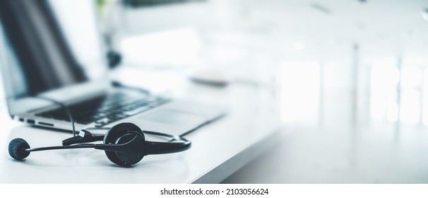 Headset and customer support equipment at call center ready for actively service . Corporate business help desk and telephone assistance concept . - Shutterstock ID 2103056624