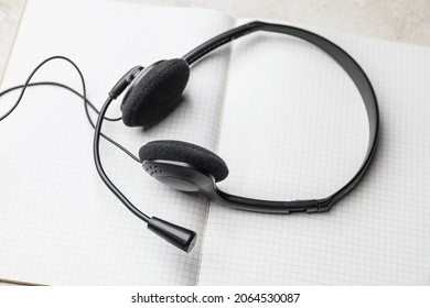 Headset with notebook on table