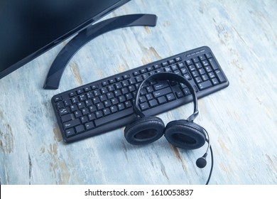 Headset on computer keyboard. Customer service. Support 
