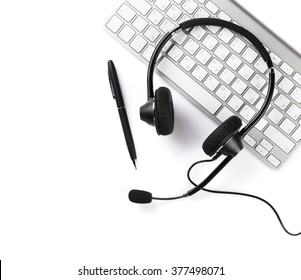 Headset, Pen And Keyboard. Call Center Support. Isolated On White Background