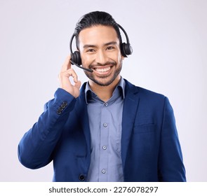 Headset portrait of happy man isolated on a white background call center, telecom job or global support. International callcenter agent, consultant or business person face in studio communication