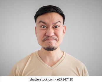 Headshot Of Angry And Mad Face Of Asian Man With Beard And Mustache.