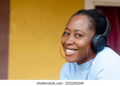 headshot of an attractive black girl on headset - Shutterstock ID 2212243249